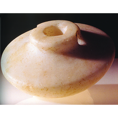 Color photo of Plate C. Early Mycenaean sword pommel of alabaster (L231).
