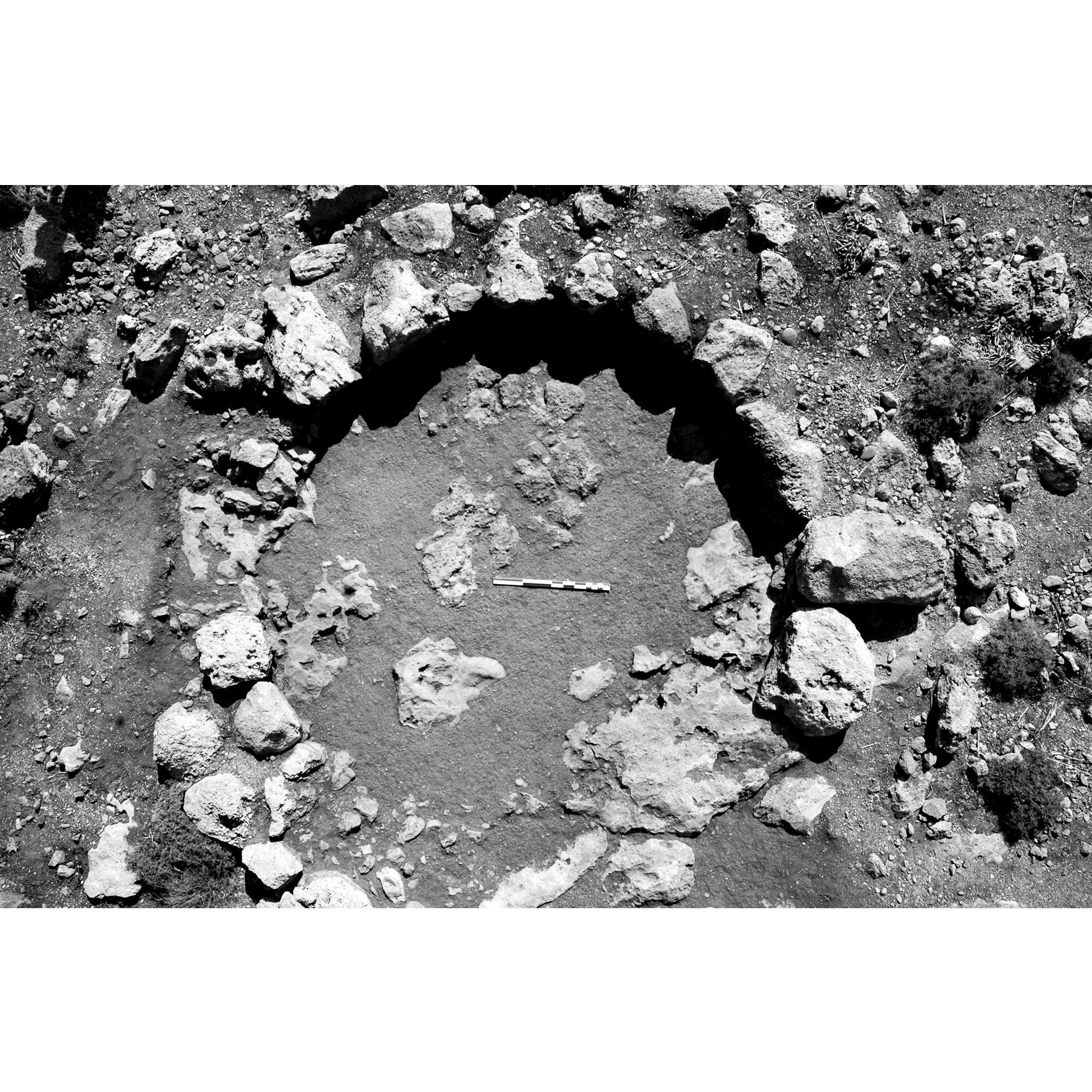 Black and white photo of Plate 4A. Tholos tomb: aerial view after removal of the burial stratum (Stratum III).