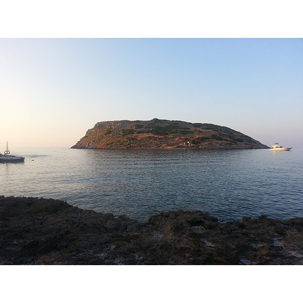 Color photo of view of the islet of Mochlos on the northeastern coast of Crete, looking north.